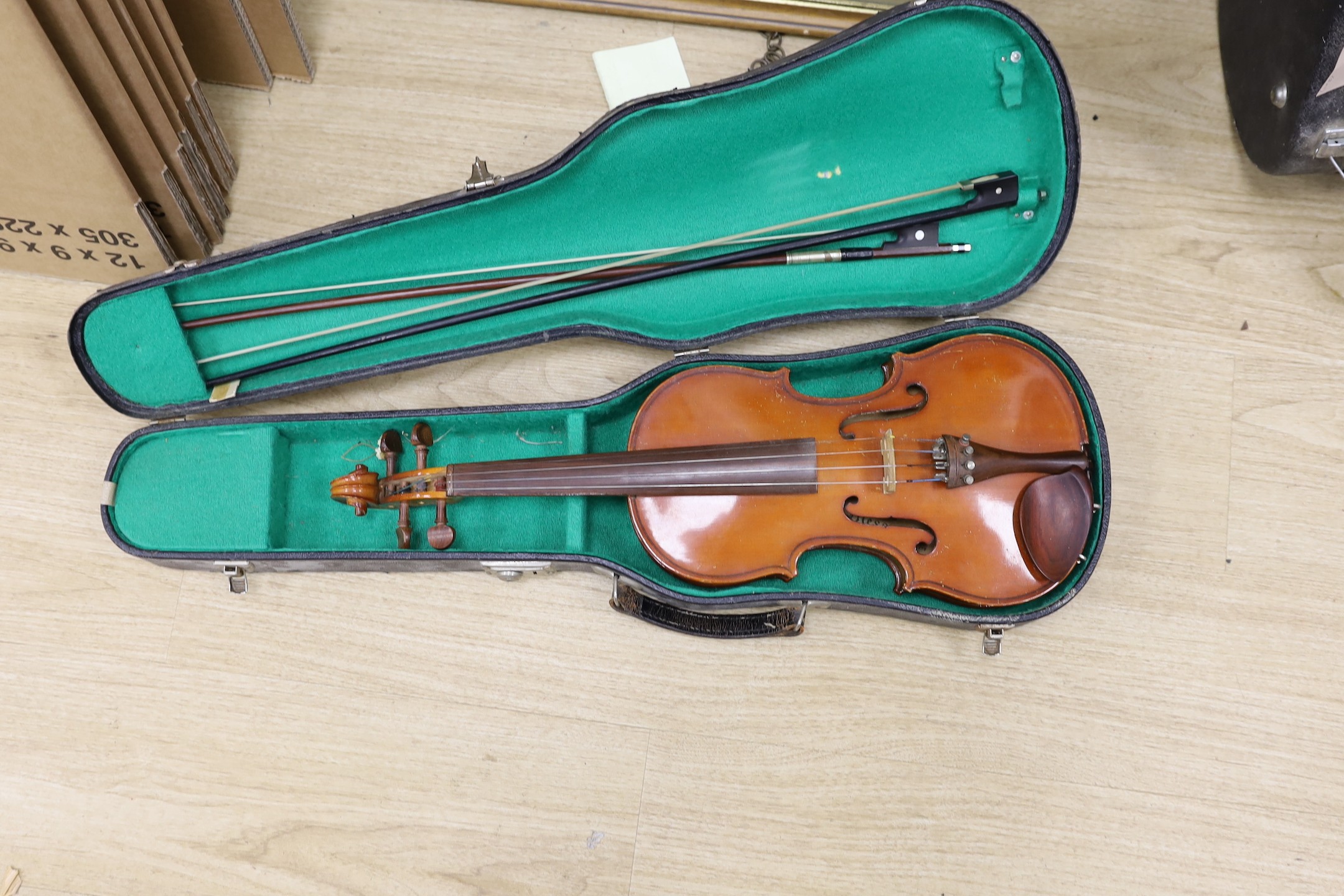 A double bass and three various violins, double bass 165cms high